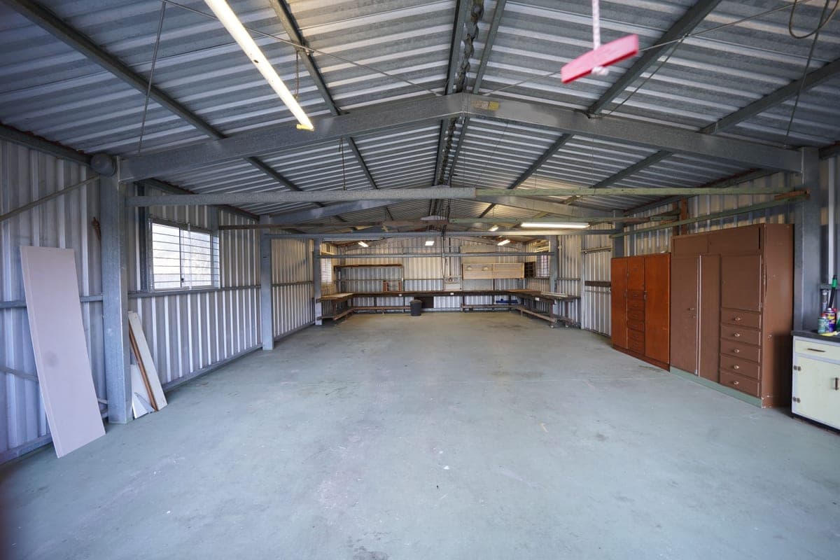 An empty warehouse with a bare concrete floor