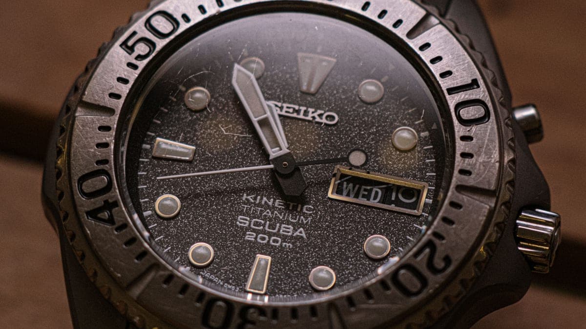 Macro of a dive watch dial and rotating bezel