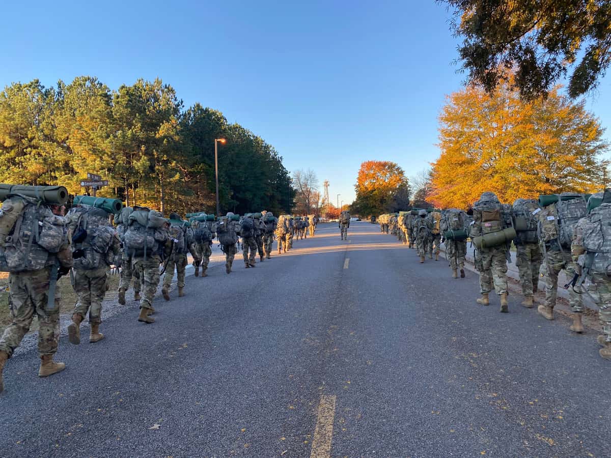 Soldiers walking along a road